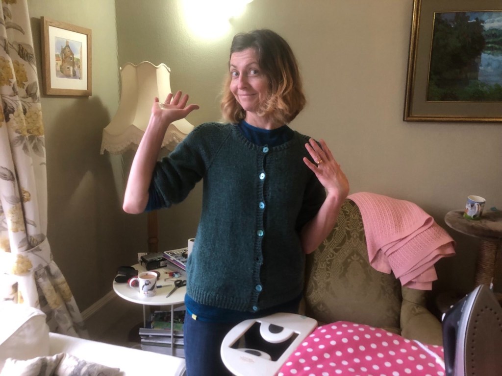 Rachel smiling and pointing at her new haircut