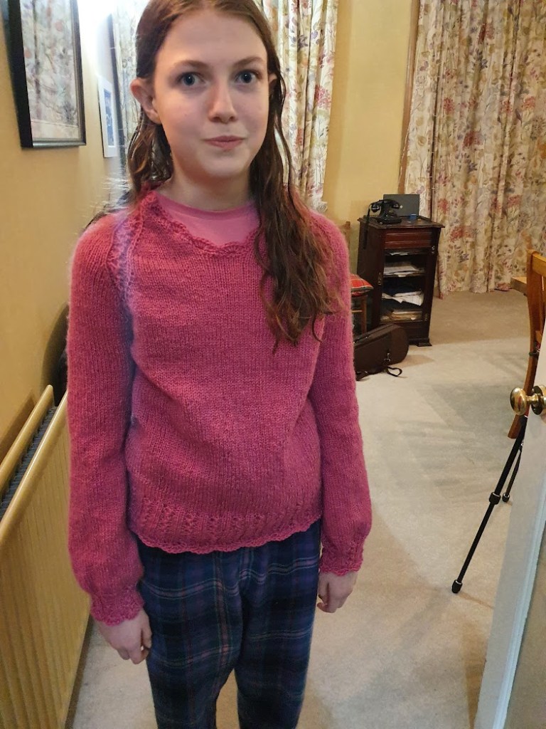 Elizabeth modelling the jumper and trying not to smile