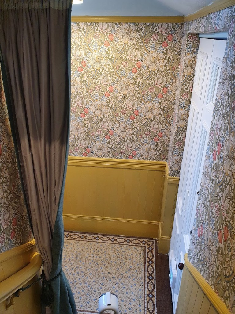 A view looking down the stairs to the entranceway.