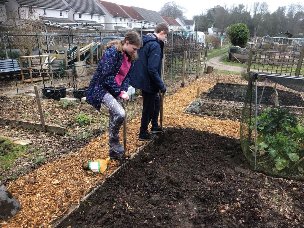 Daniel and Elizabeth digging