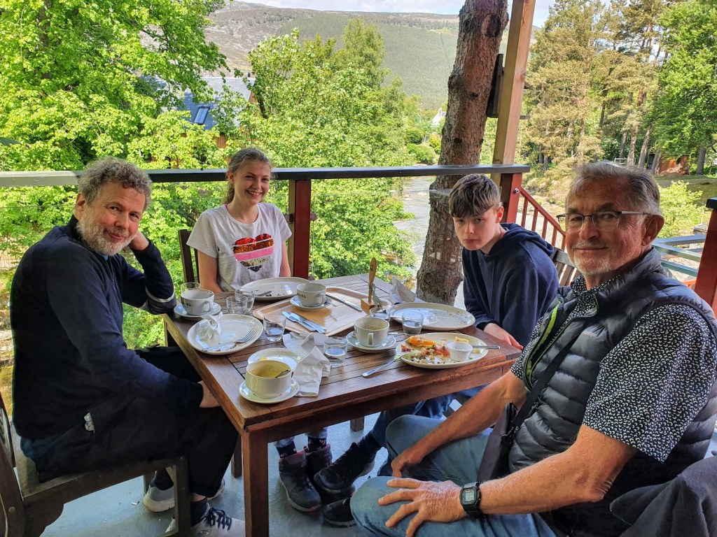 Ben, Elizabeth, Daniel, and Dad sitting down for lunch.