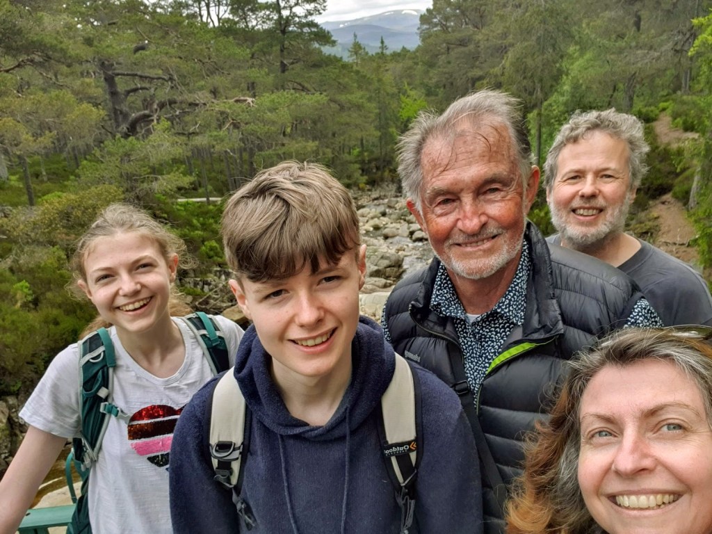 A selfit of the five of us from the bridge with the hills in the distant background.