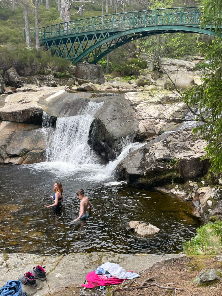 Me and Daniel in the water beneath the waterfall.