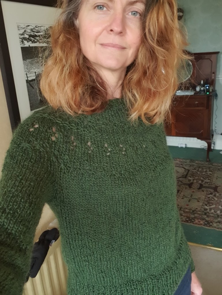 Me wearing my knitted green jumper