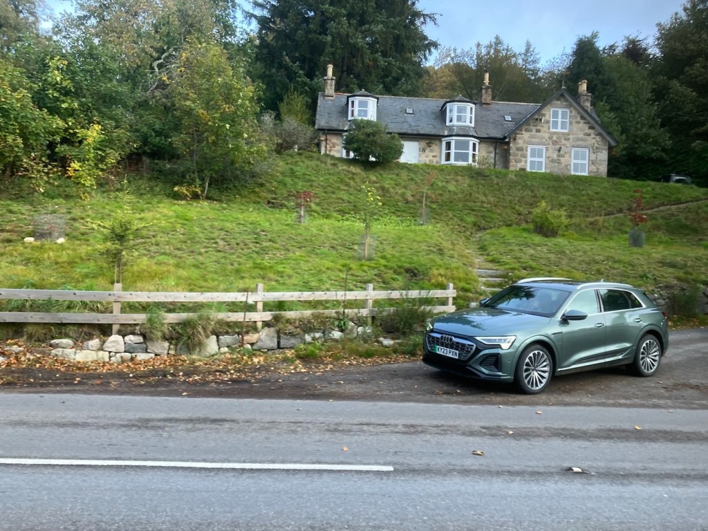 Kind Charles waving through the window as he drives past.