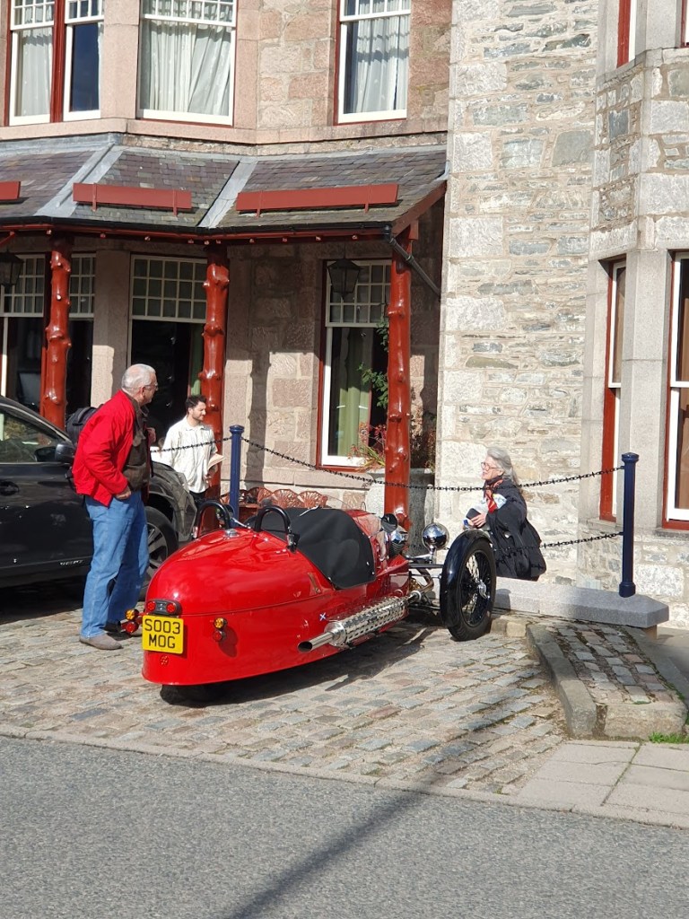 Red car with three wheels.