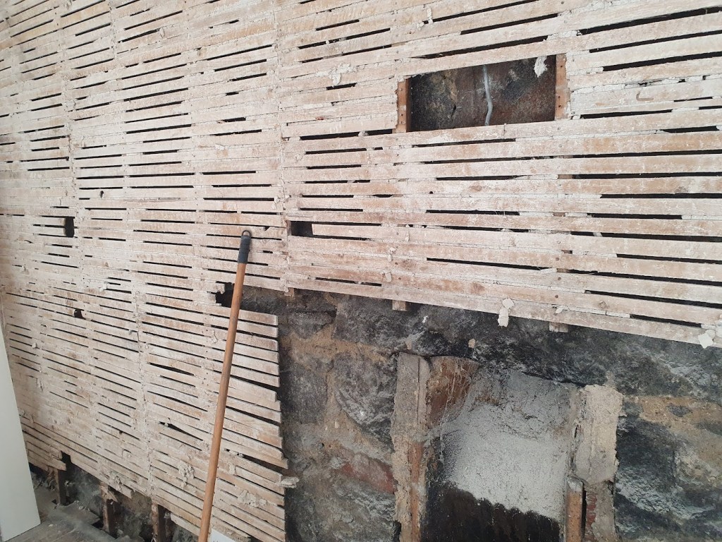 Lath and plaster plus the fireplace hole.