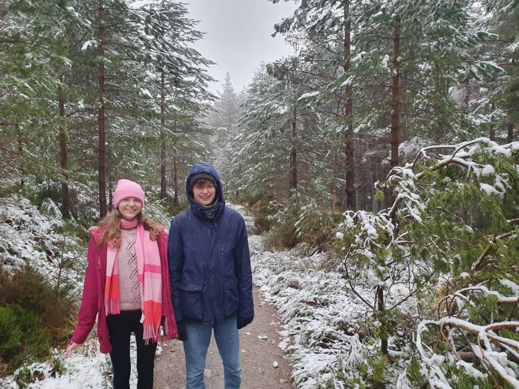 Daniel and Elizabeth on the path to the Green Loch and smiling for the camera.