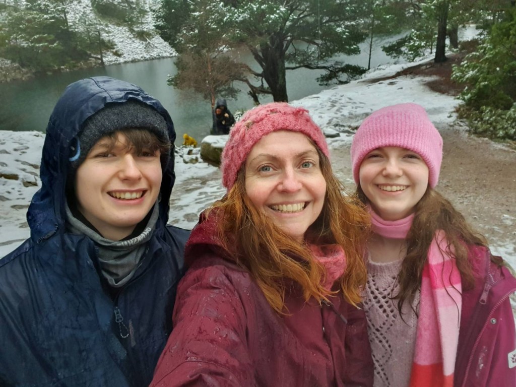 A selfie of Daniel, Rachel and Elizabeth with the loch behind us.