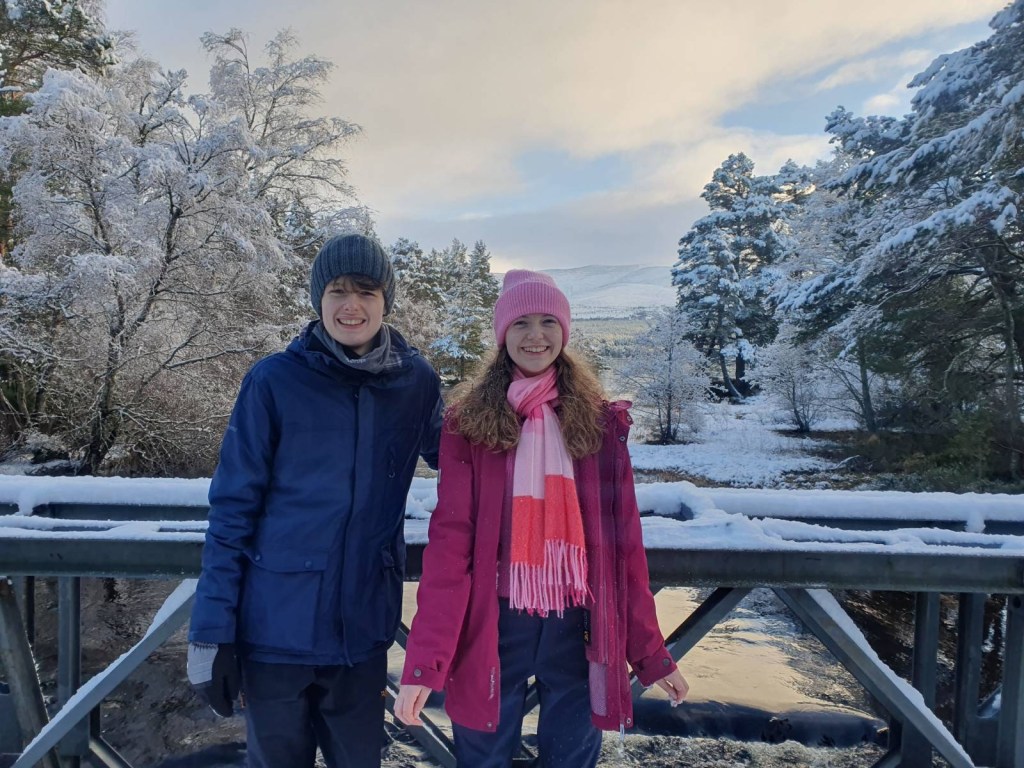 Elizabeth and Daniel on the bridge next to Loch Morlich