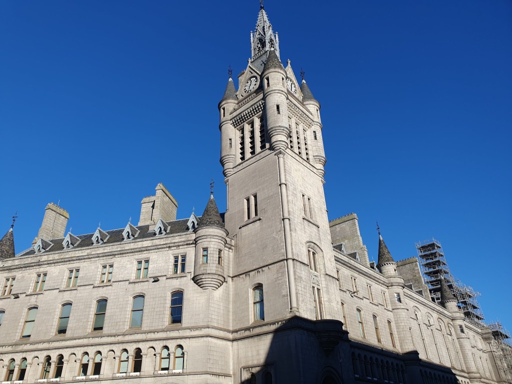 Aberdeen's Town House with it's imposing tower set against a brilliant blue sky.