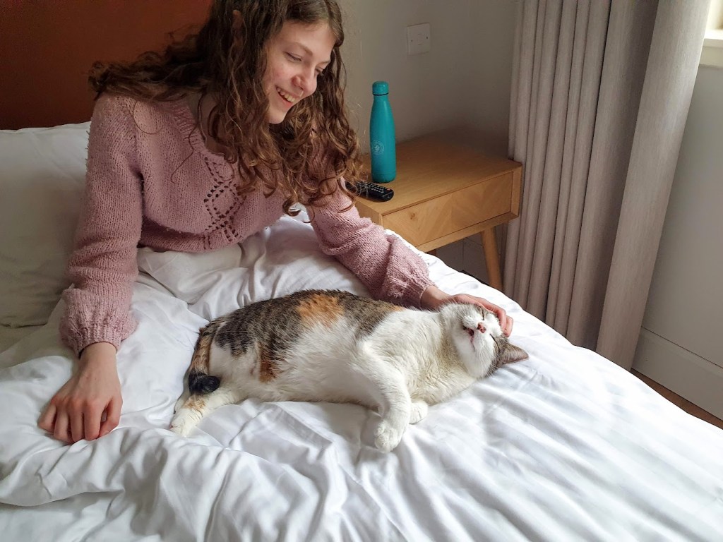 Elizabeth giving Victoria a pat.