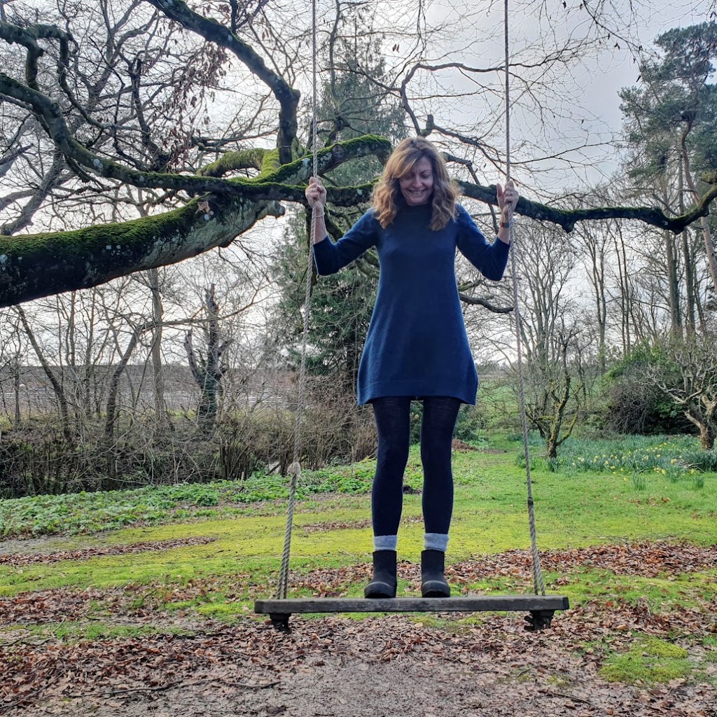 Rachel on the swing in the grounds.