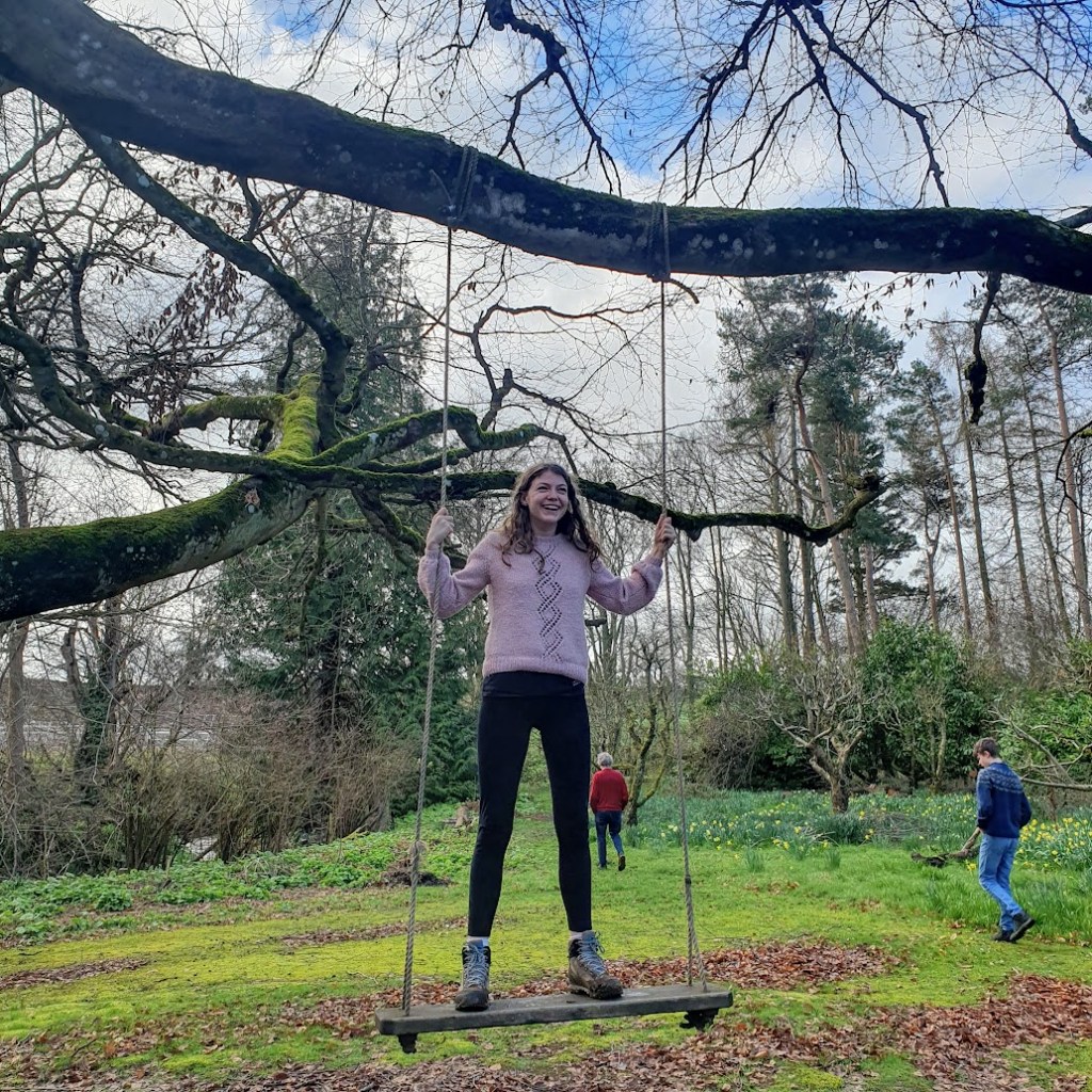 Elizabeth on the swing in the grounds.