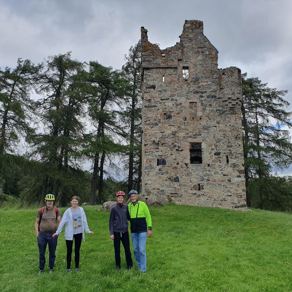 Ben, Elizabeth, Daniel, and Dad standing in front of the ruin Knock Castle. 