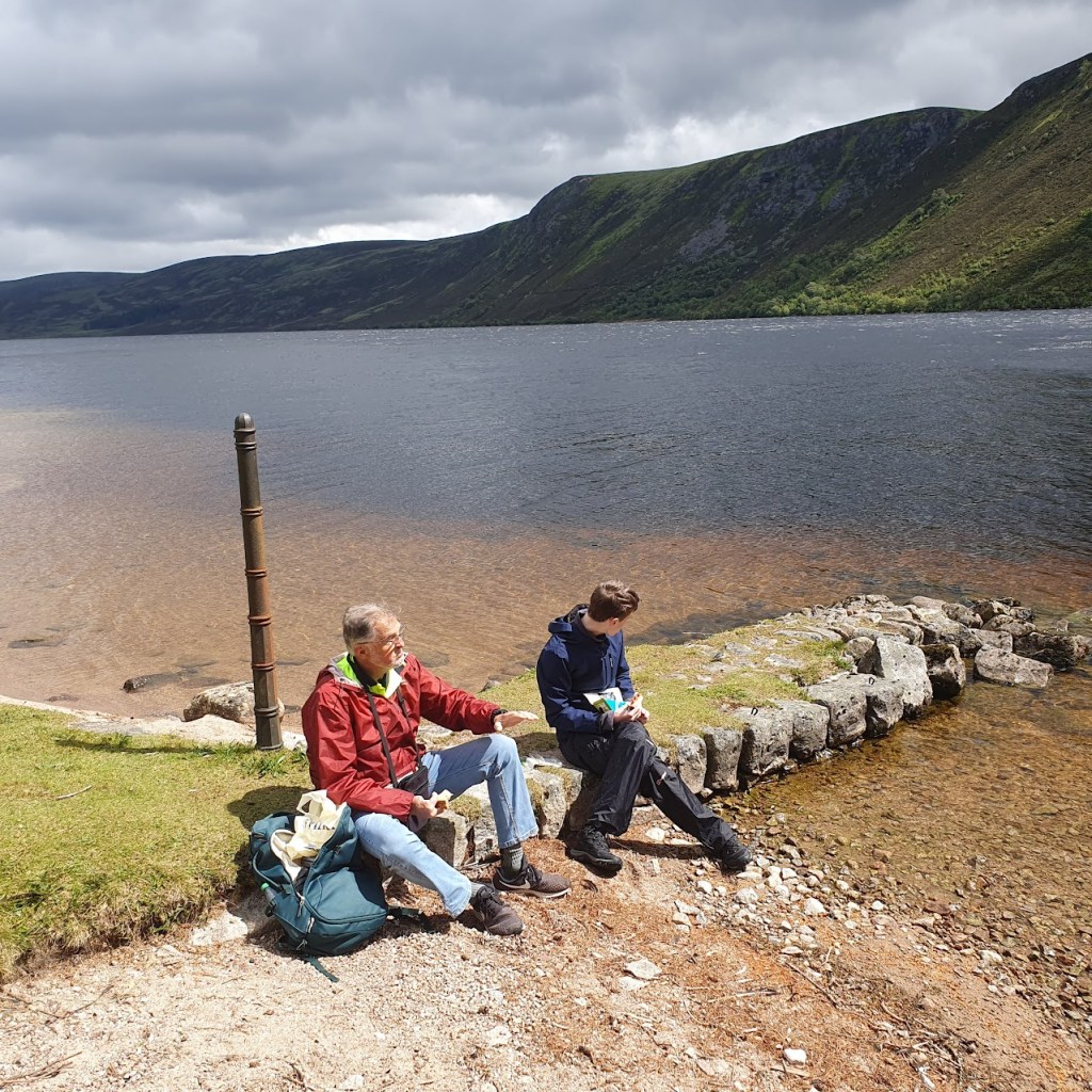 Dad and Daniel beside the loch.
