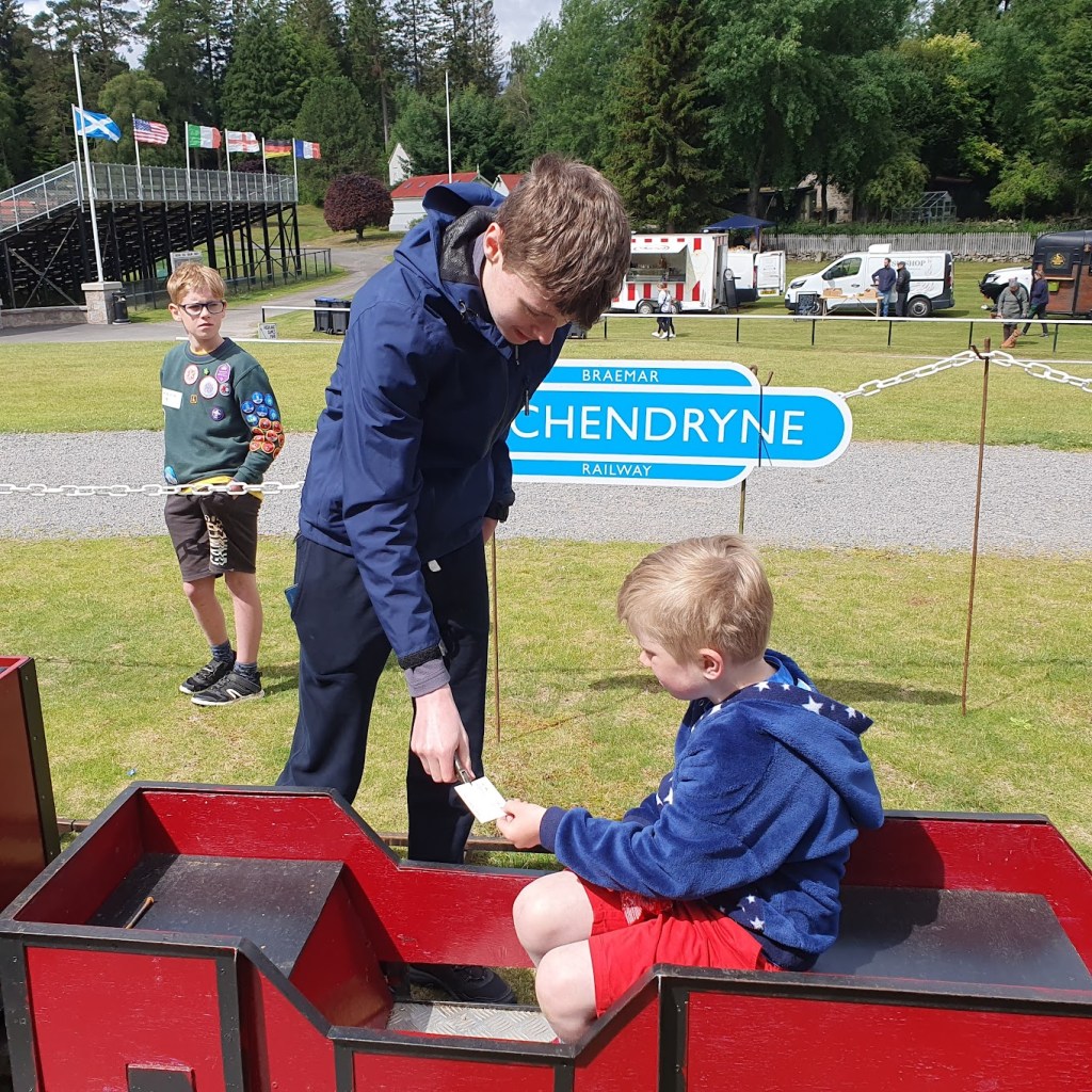 Daniel stamping tickets for the train.