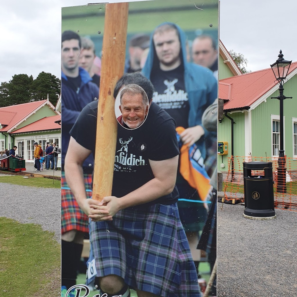 Dad pretending to toss the caber.