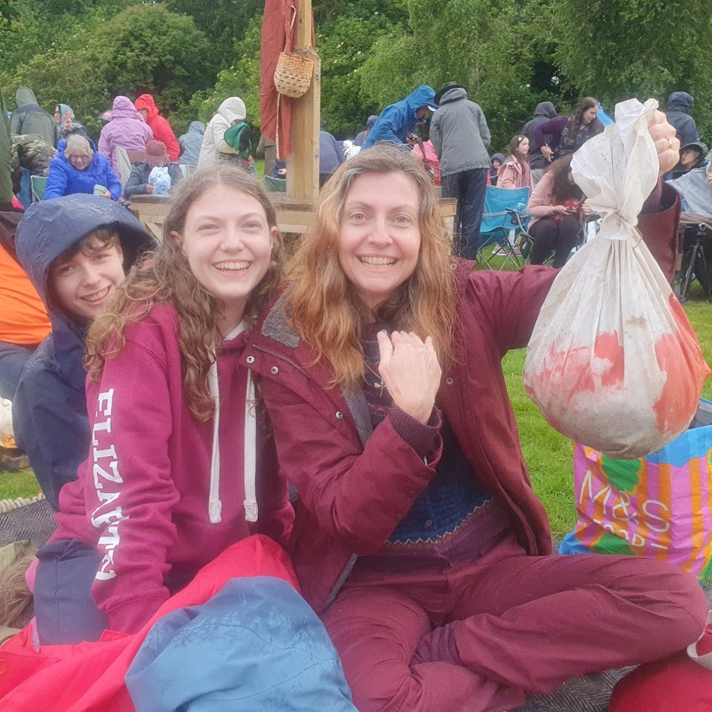 Rachel holding a severed head with Daniel and Elizabeth.