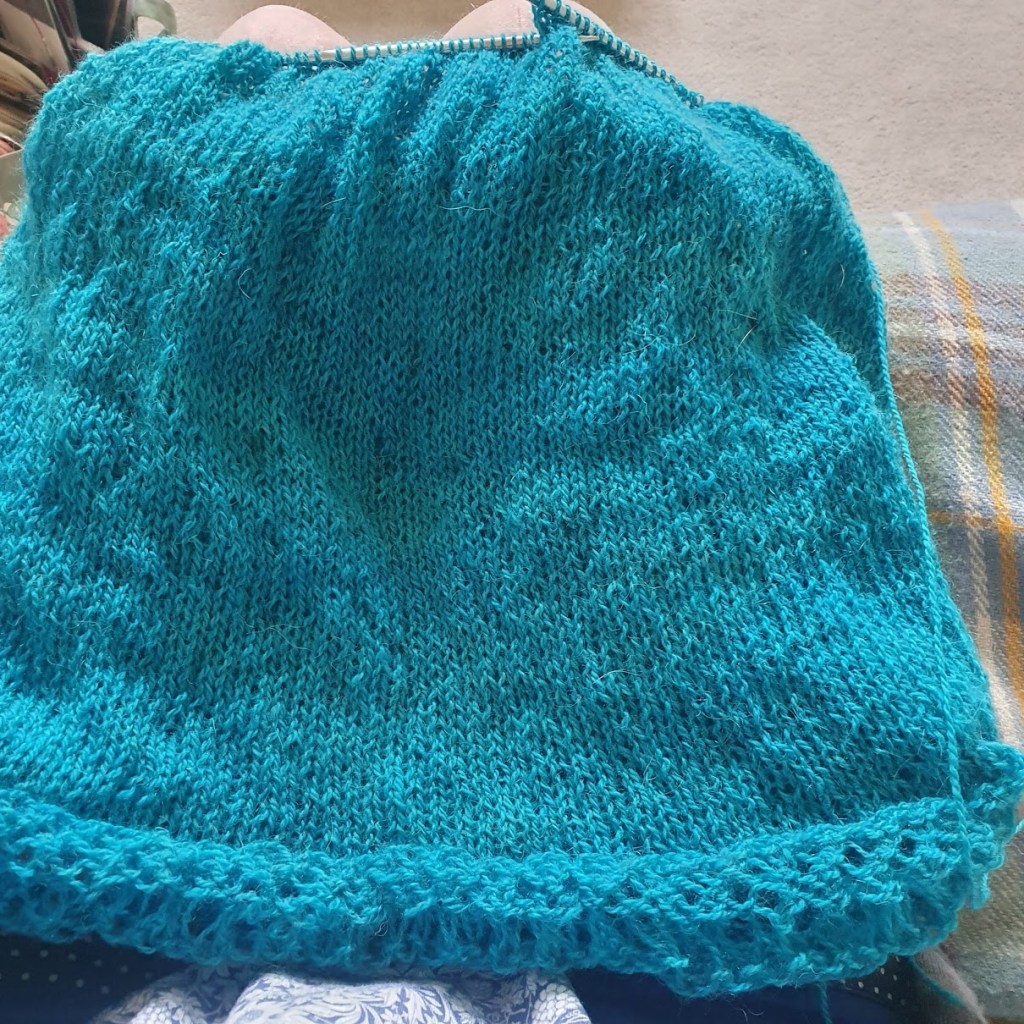 Knitting in a turquoise blue colour.
