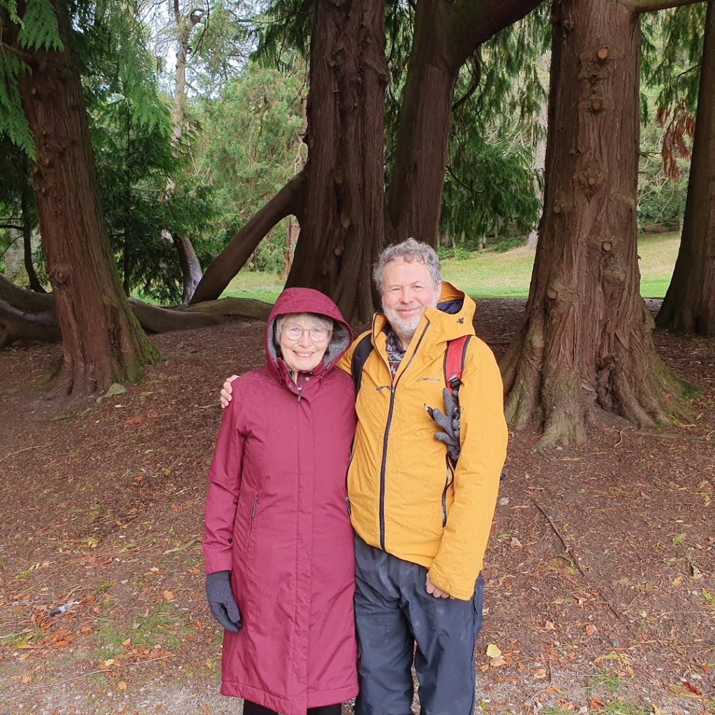 Ben and Di standing under some very old trees.