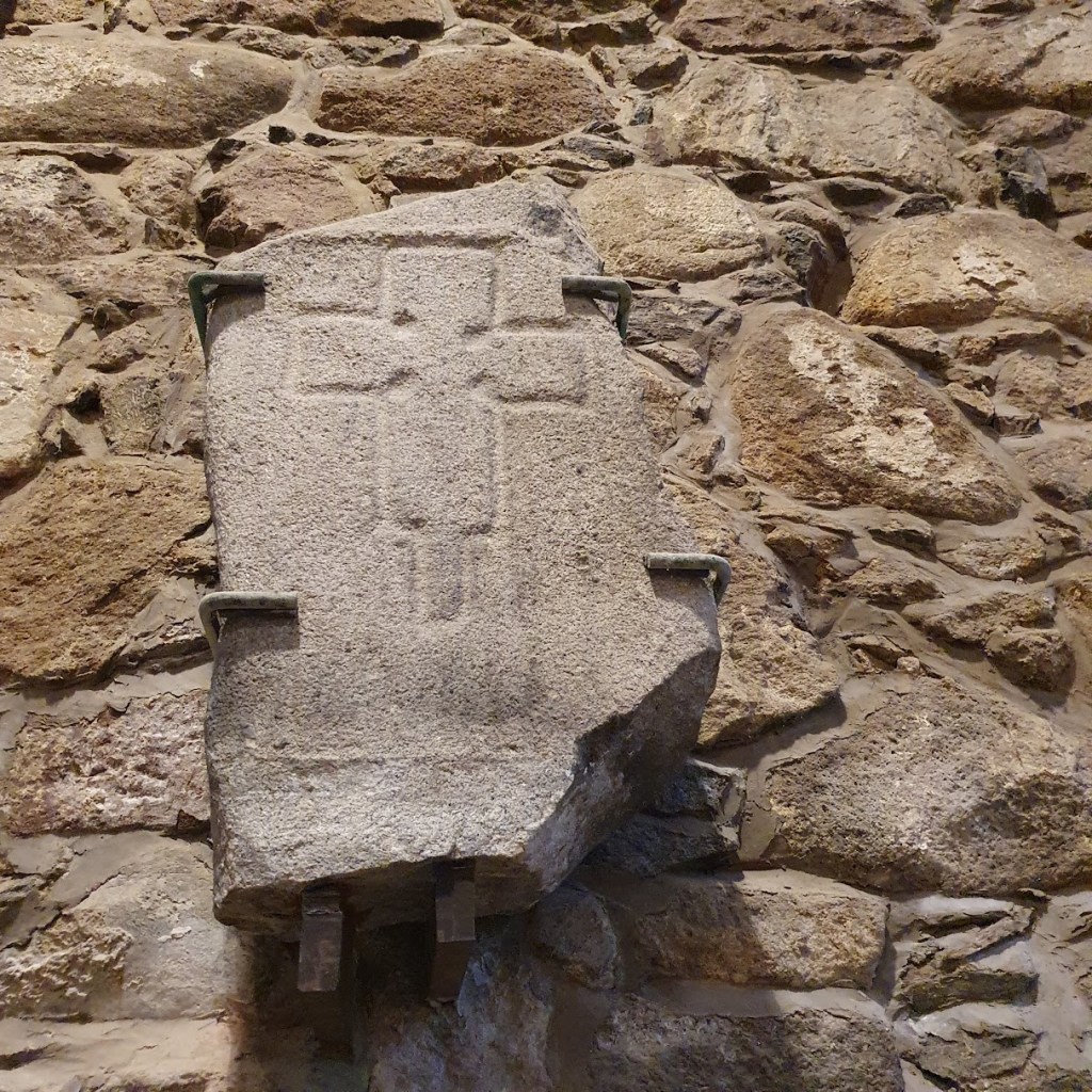 Pictish cross carved into stone.