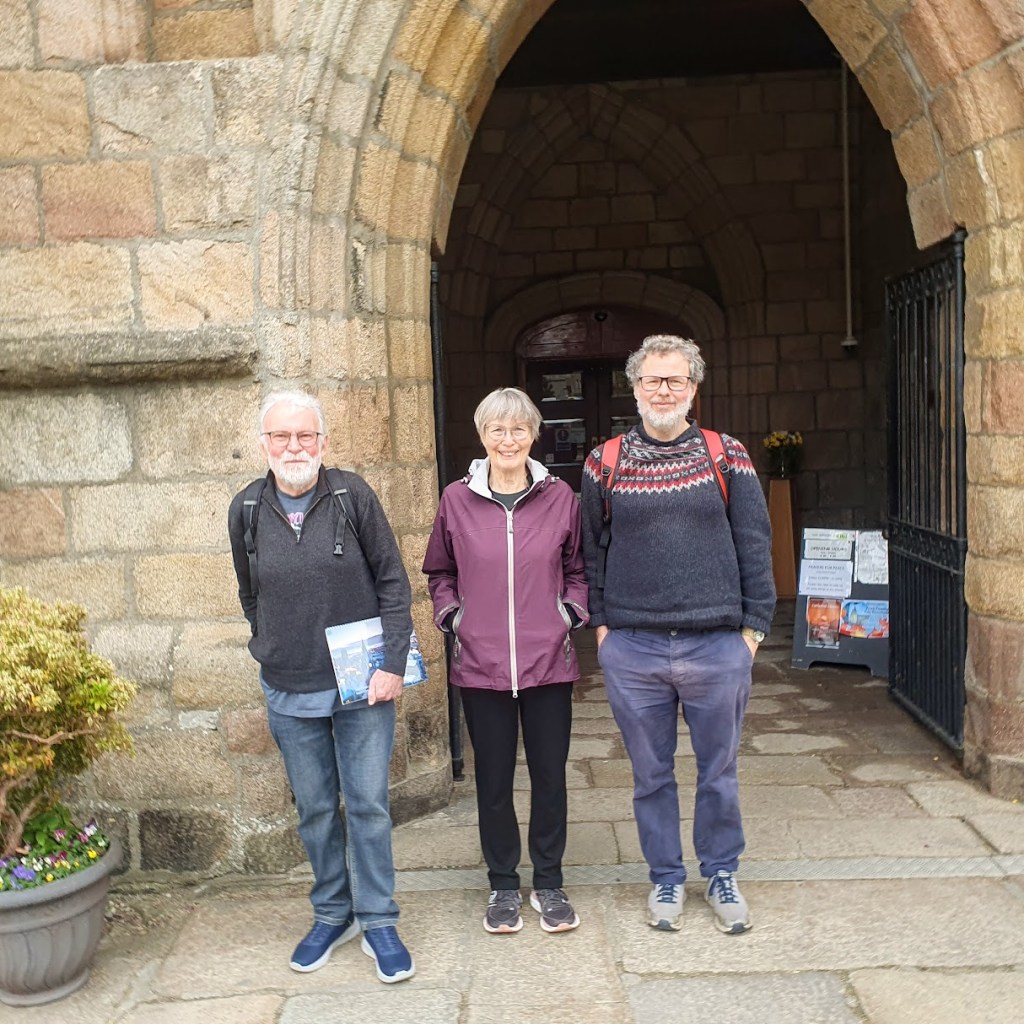 Peter, Di, and Ben standing outside St Machar Cathedral.