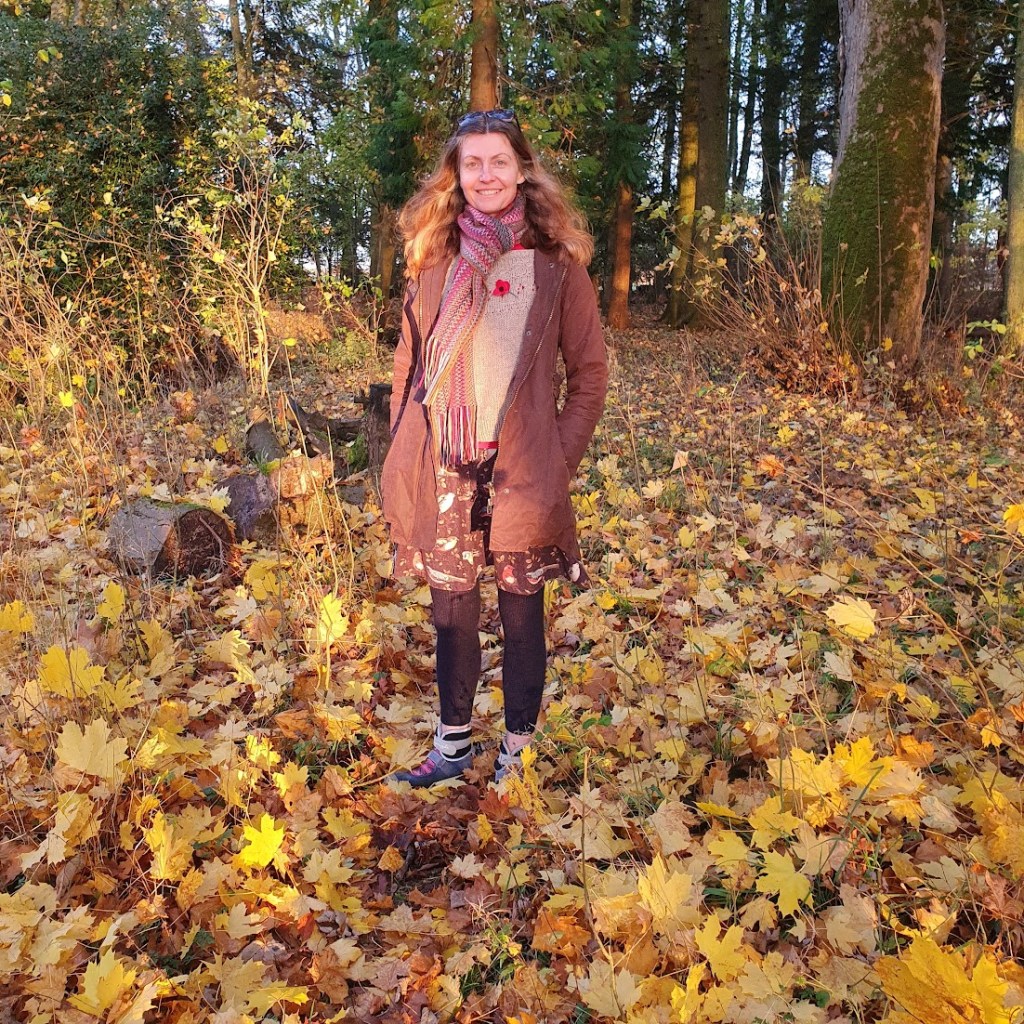 Me standing in a forest with yellow leaves everywhere.