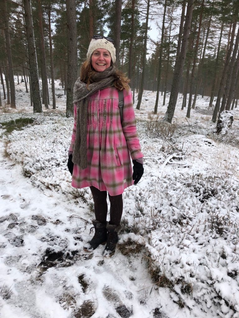 Rachel looking very happy but covered in snow.