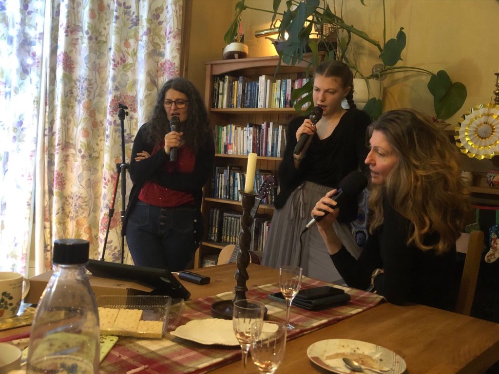 Eileen, Elizabeth and Rachel singing karaoke.