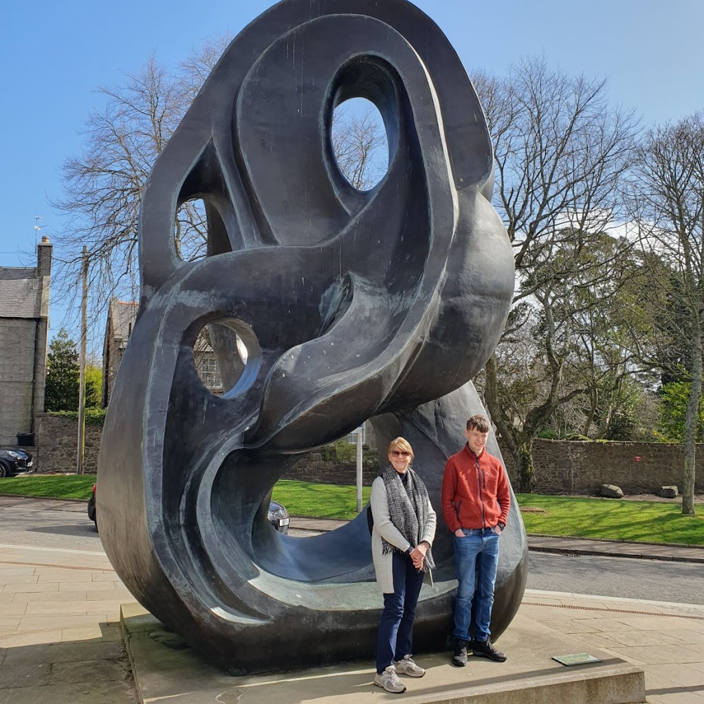 Mum and Daniel in front of the Evolutional Loop 517 sculpture at Aberdeen Uni.