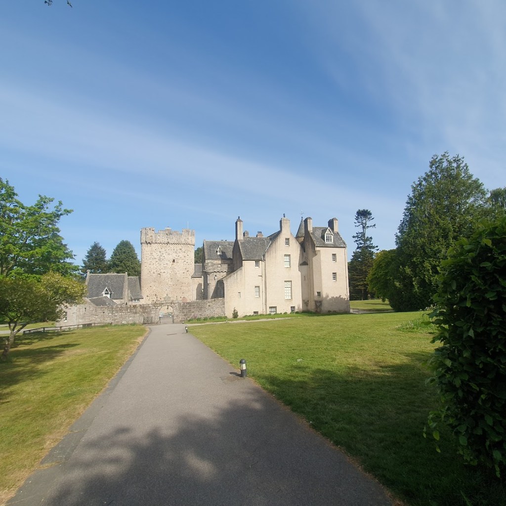 A close-up of Drum Castle with a clear blue sky behind.