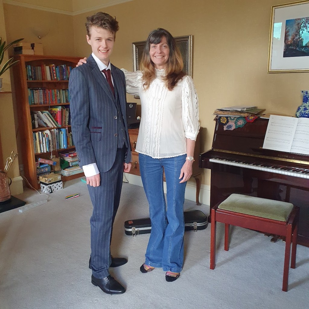 Me standing proudly next to Daniel at home before the prom.