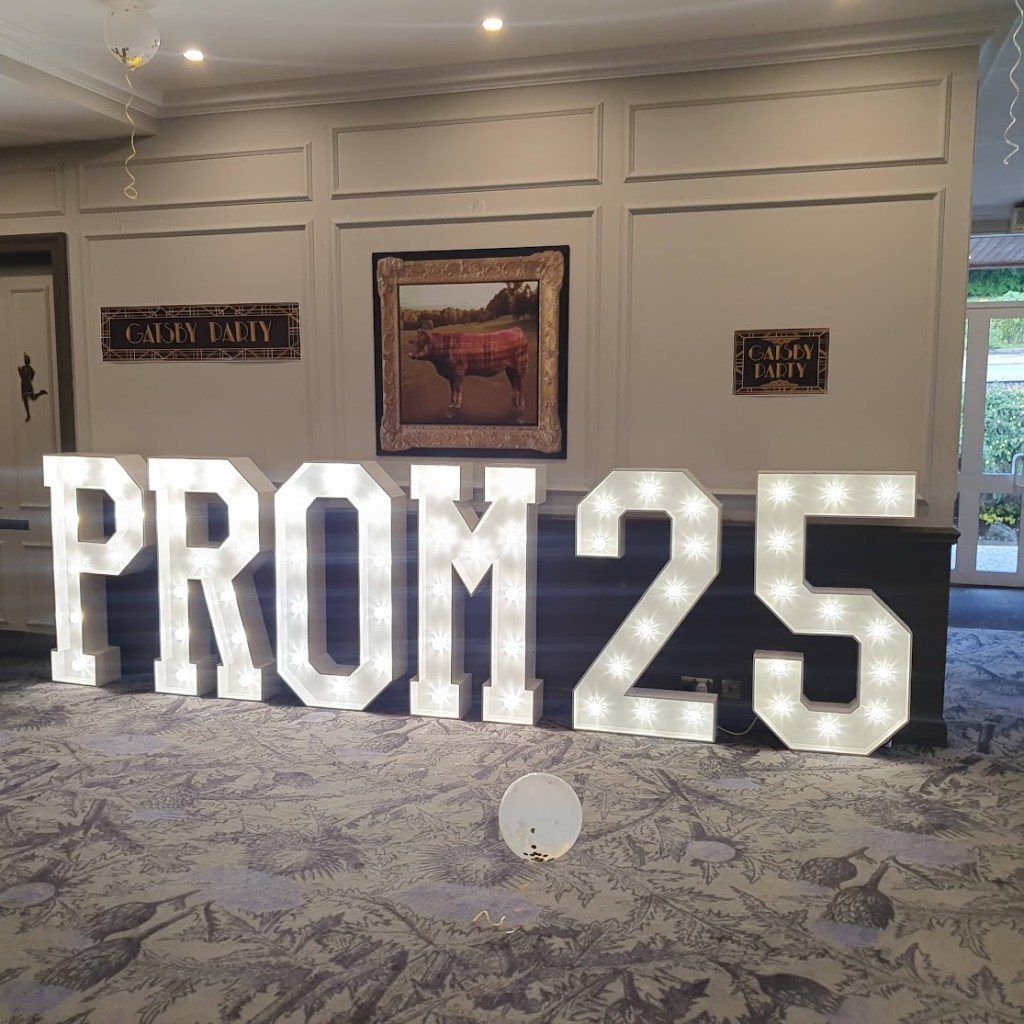 Large lights with the words "PROM25".