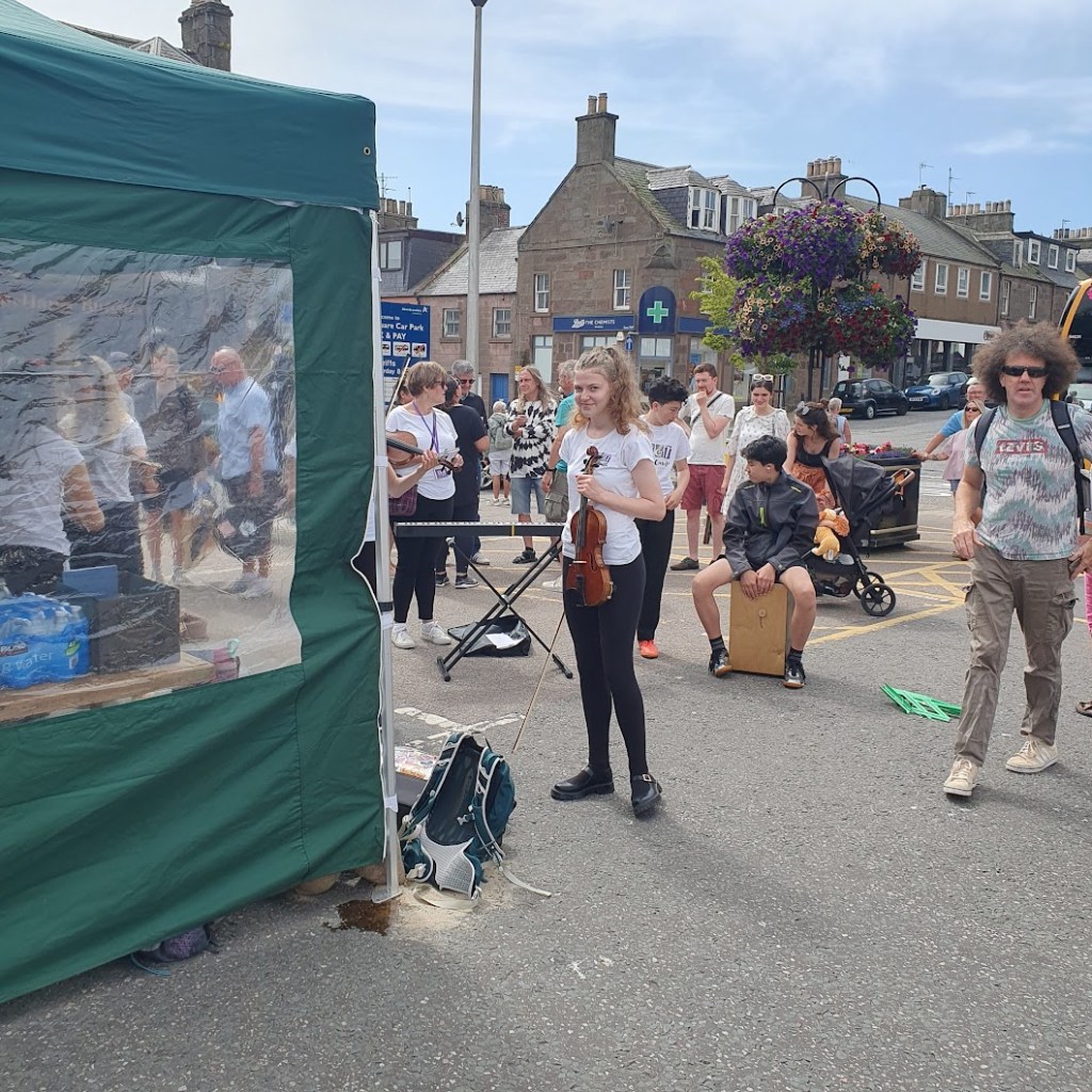 Elizabeth with her violin ready to play at the folk festival.