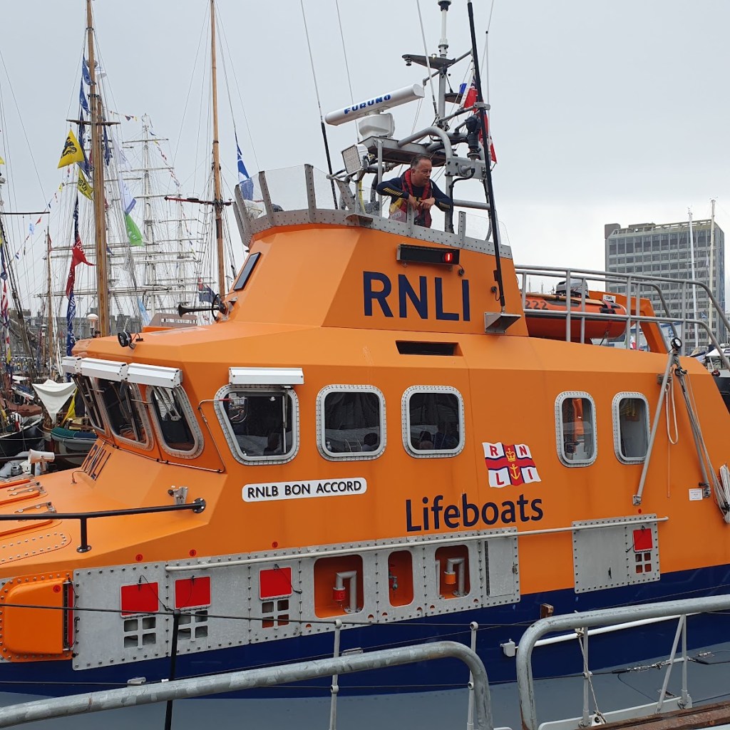 The orange RNLI boat.