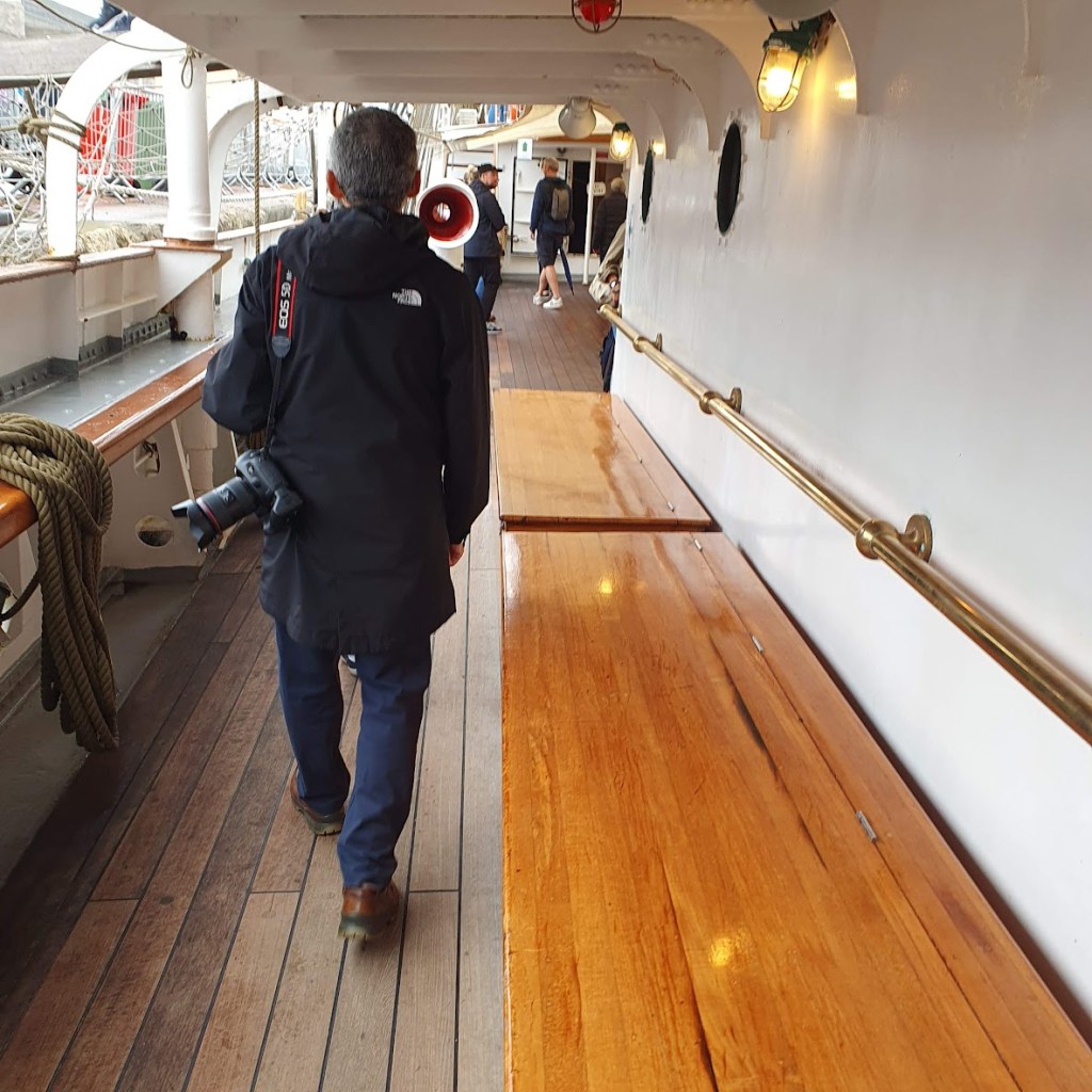 On the deck of the ship.