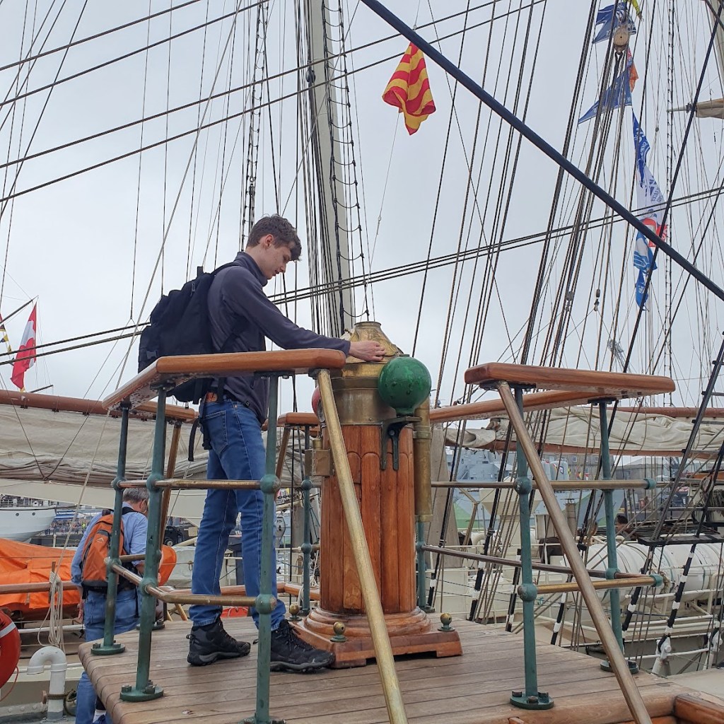 Daniel looking at some kind of navigational device.