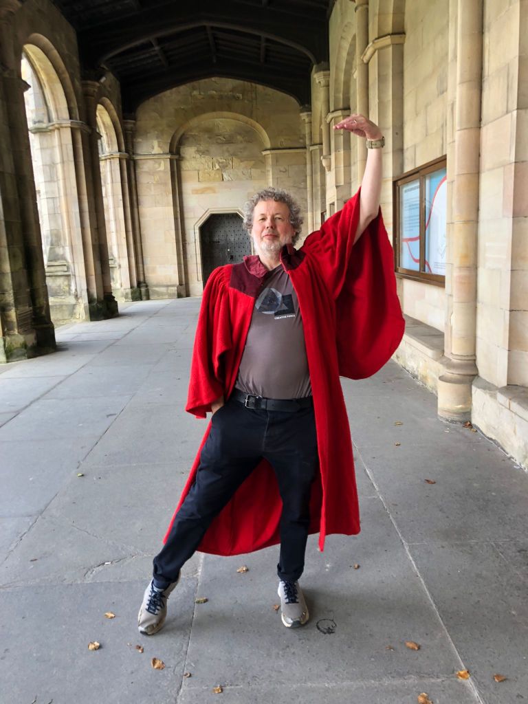 Ben wearing the gown and trying to do a highland dance position.