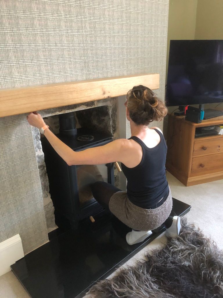 Me doing the final touches of wallpaper.