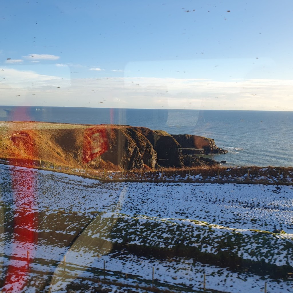 Another view from the train of snowy cliffs overlooking the north sea