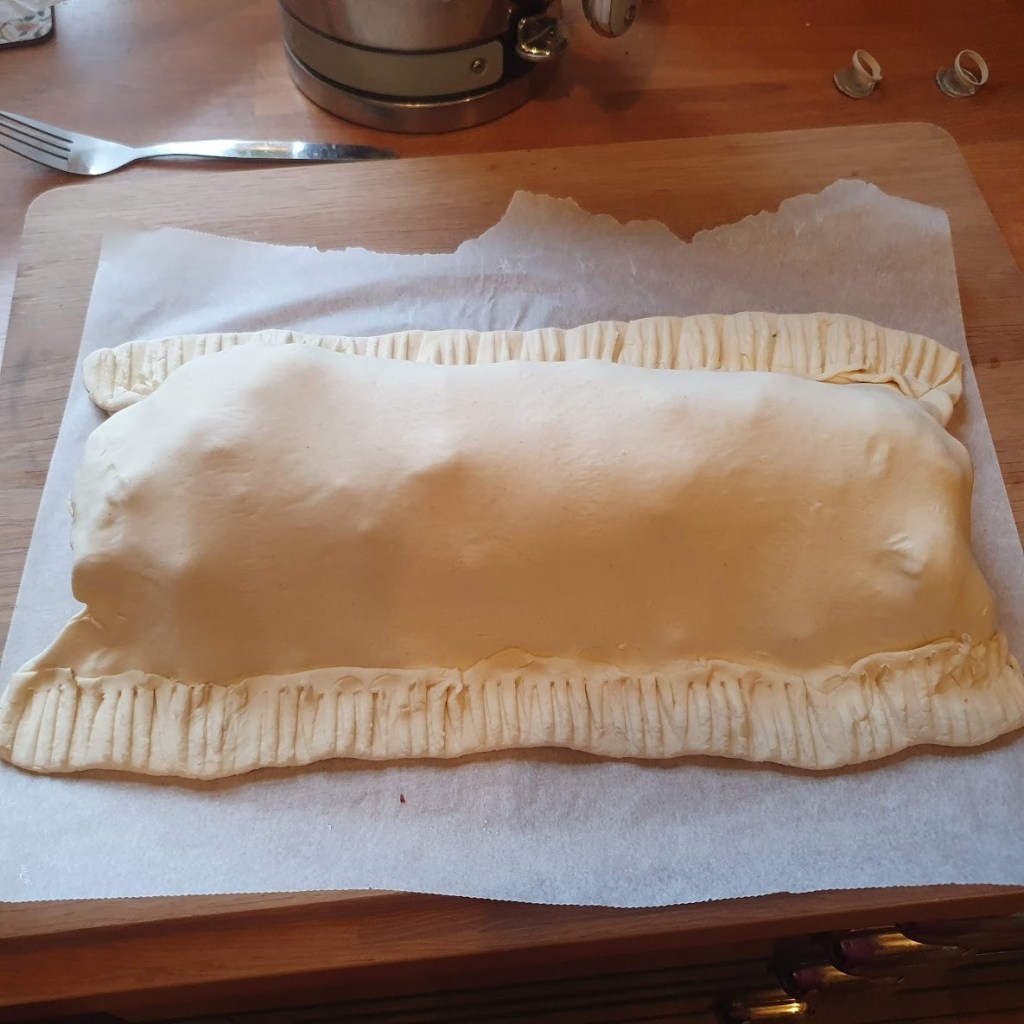 Wellington fully enclosed in pastry but not yet cooked