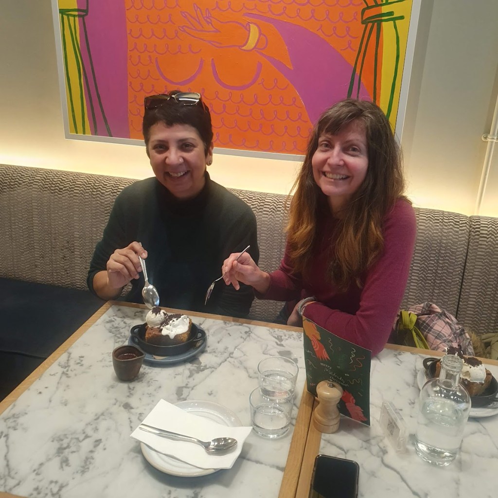 Diya and Rachel about to tuck into dessert.