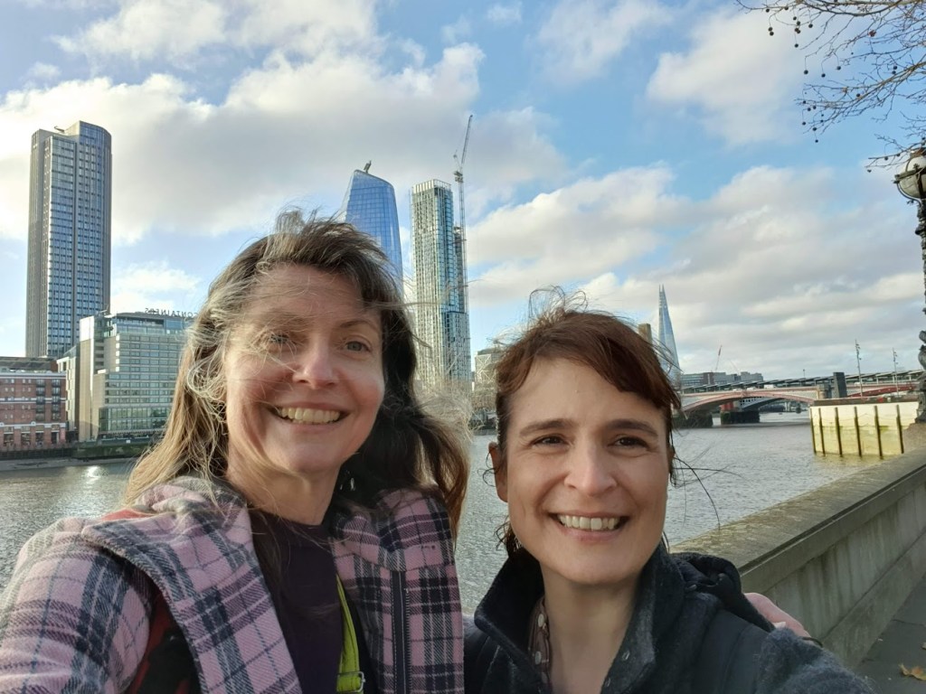 Rachel and Sarah walking next to the Thames