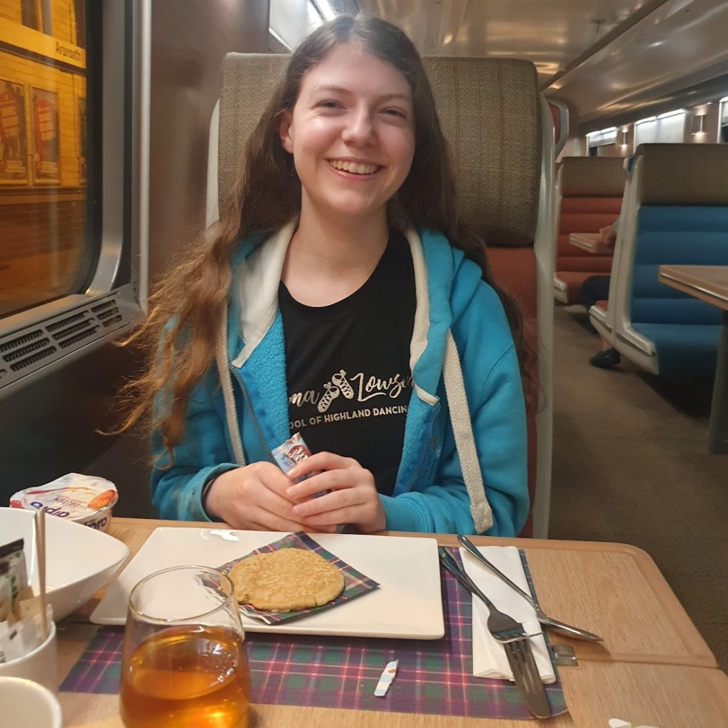 Elizabeth on the train with her pancake