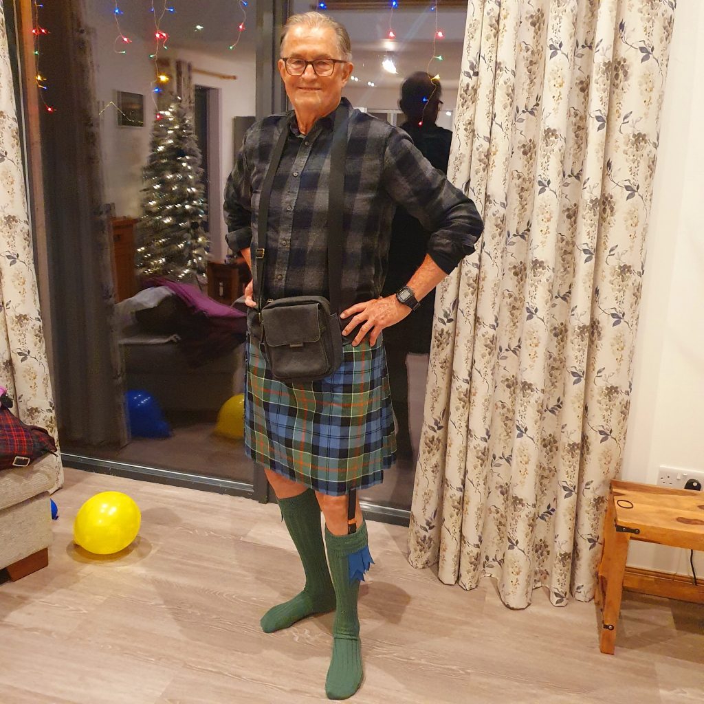 Dad wearing his kilt which is in the Colquhoun tartan.