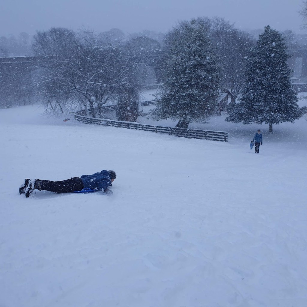 Daniel sliding down on his stomach