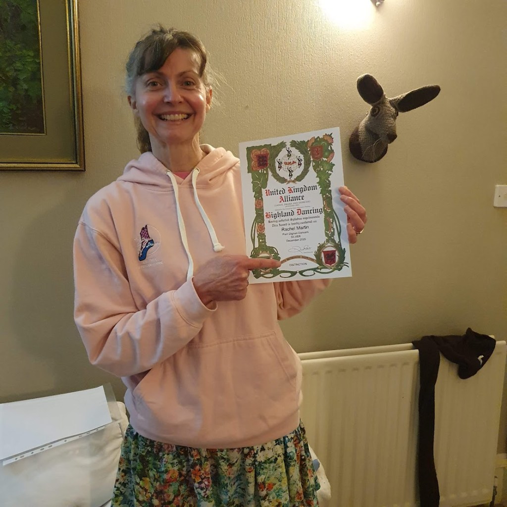 Me holding my highland dance result