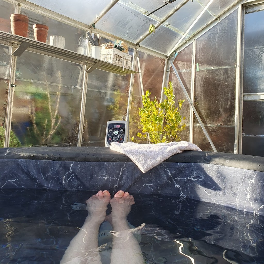 View from the hot tub showing my feet and the temperature control