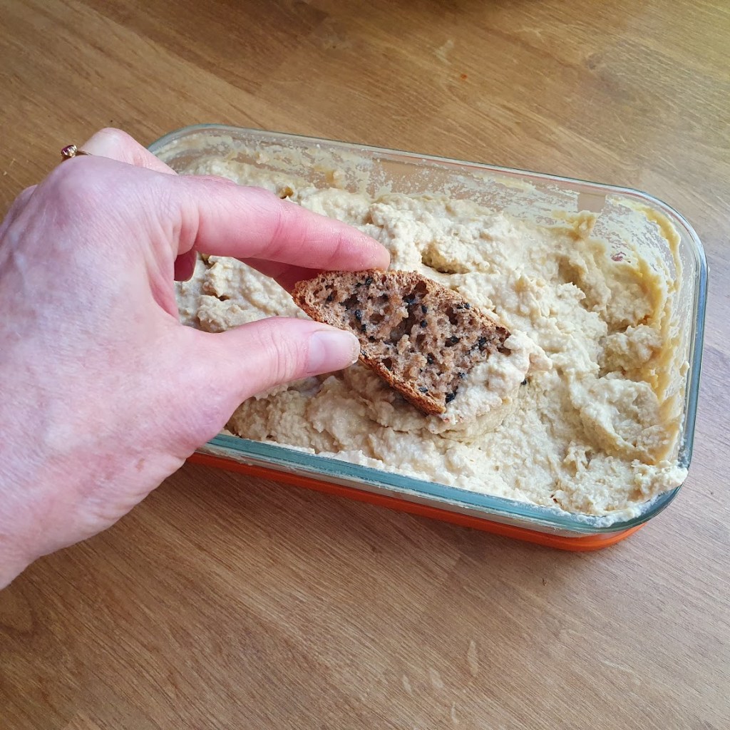 Hummus with sourdough dipped in.